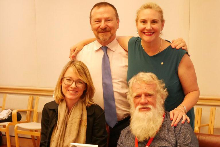 ruce Pascoe and Anna Moulton from Magabala with Grahame and Hollie, holding the Dark Emu book